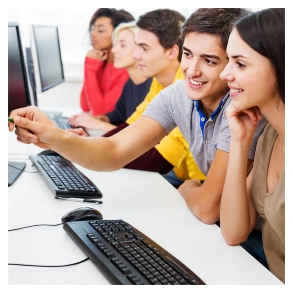 teenagers using computers at school